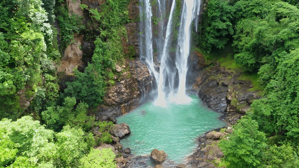 Cunca Rami Waterfall with full water flow during the green season in Flores Indonesia