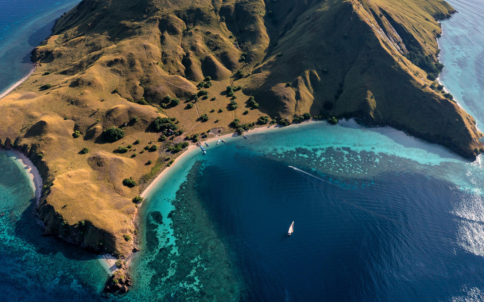 gili lawa island aerial view with turquoise bay and boats in Komodo National Park