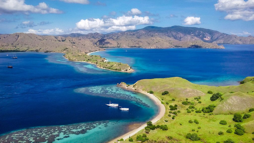 aerial view of Gili Lawa coastline and clear blue waters ideal for snorkeling and trekking