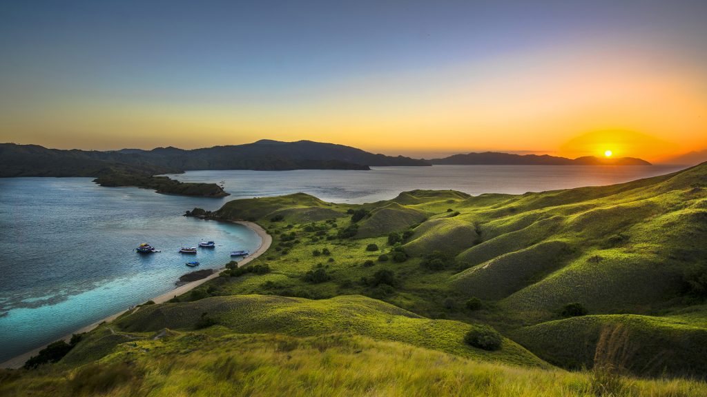 sunset view over Gili Lawa hills and coastline in Komodo National Park