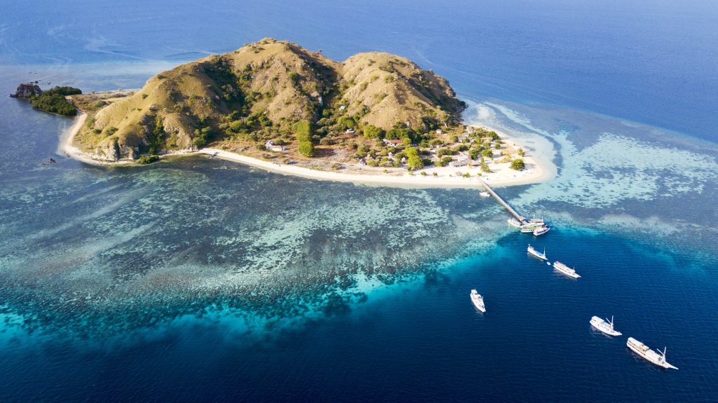 clear turquoise water and beach at kanawa island near labuan bajo