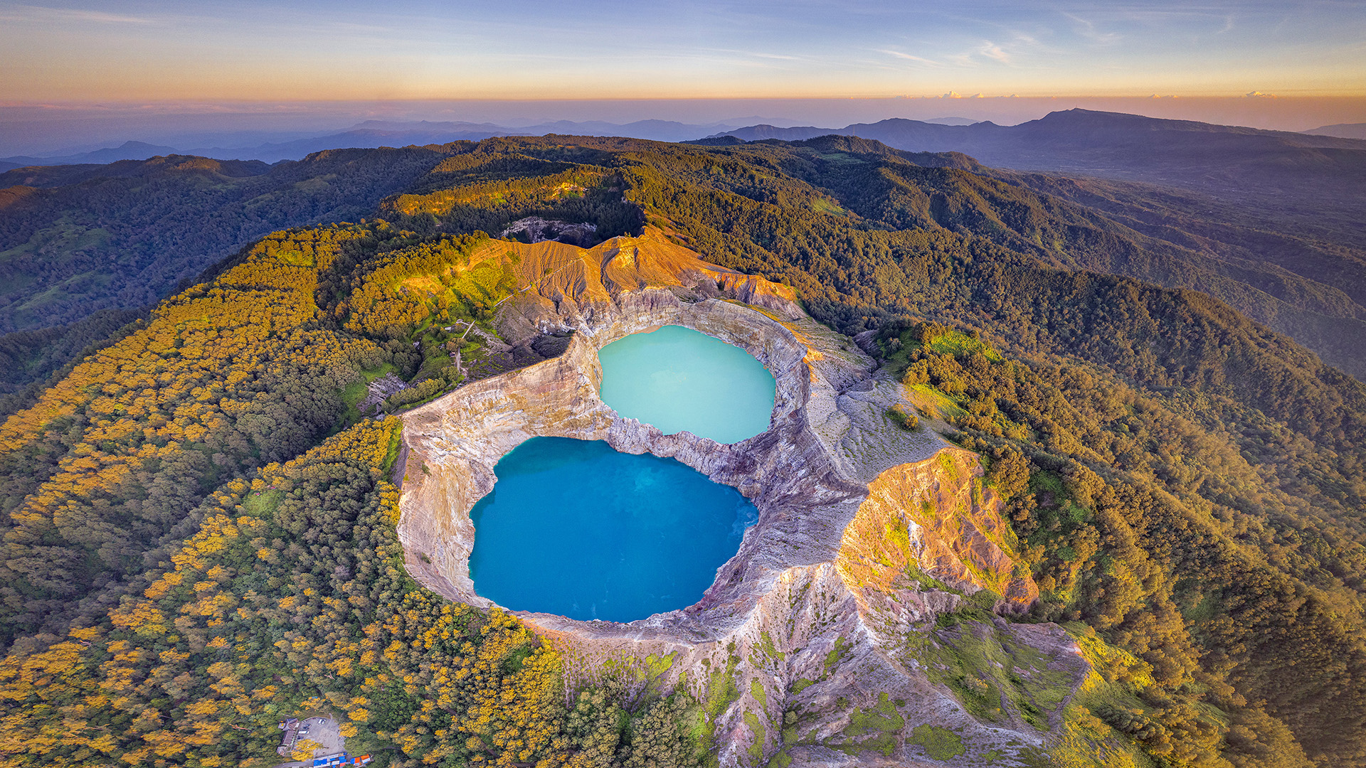 Kelimutu National Park crater lakes with changing colors at sunrise in Flores Indonesia