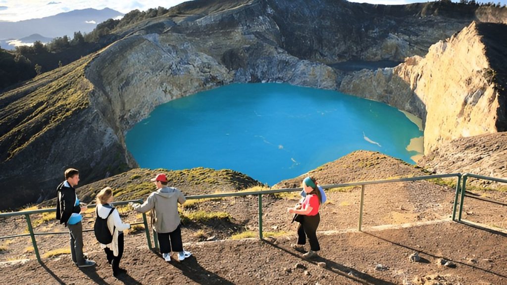 Visitors enjoying the viewpoint at Kelimutu crater lake in Flores Indonesia