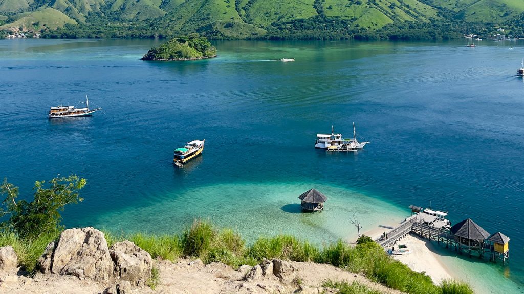 Bright sunny day at Kelor Island Labuan Bajo with calm sea and clear visibility during dry season