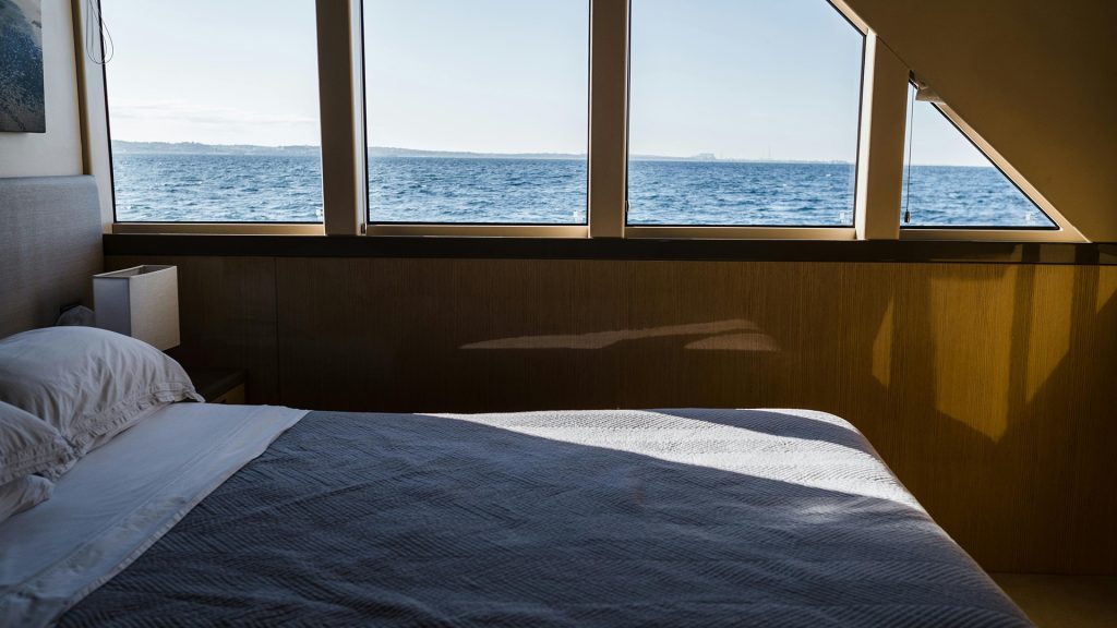 comfortable bed inside boat cabin during komodo national park liveaboard cruise