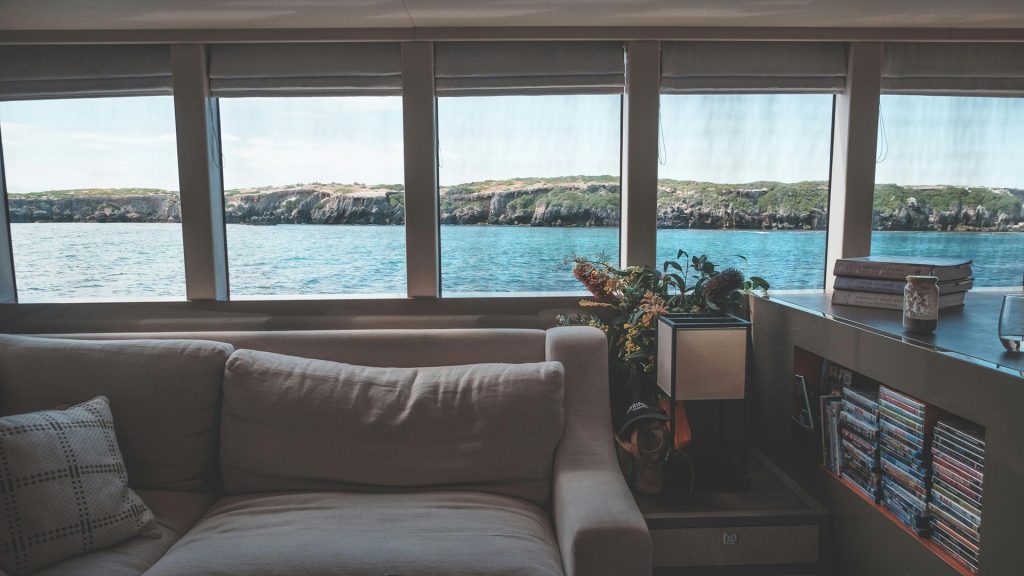 comfortable liveaboard cabin with ocean view windows near Komodo National Park