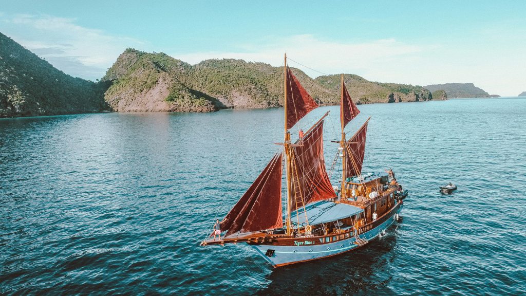 traditional pinisi boat sailing in komodo national park near labuan bajo