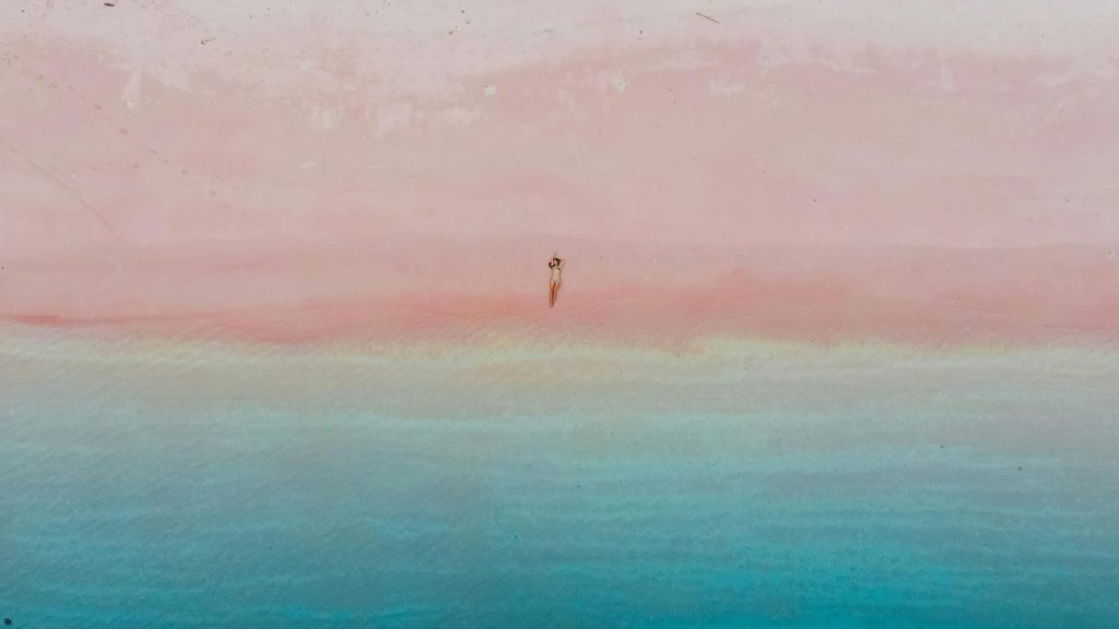 aerial view of pink beach with turquoise water in komodo national park