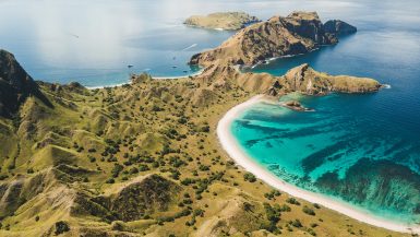aerial view of pink beach in komodo national park with turquoise water