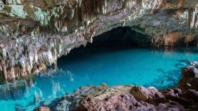 rangko cave labuan bajo with crystal clear underground lake and limestone formations