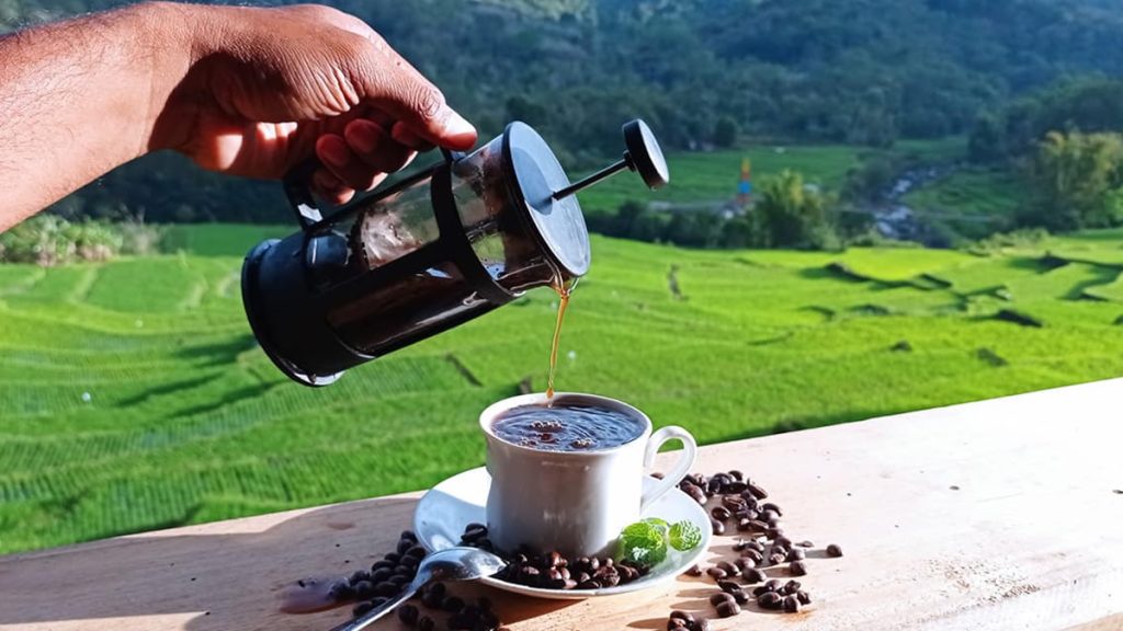 Detusoko robusta coffee served at Cafe Lepalio with rice field view in Flores Indonesia
