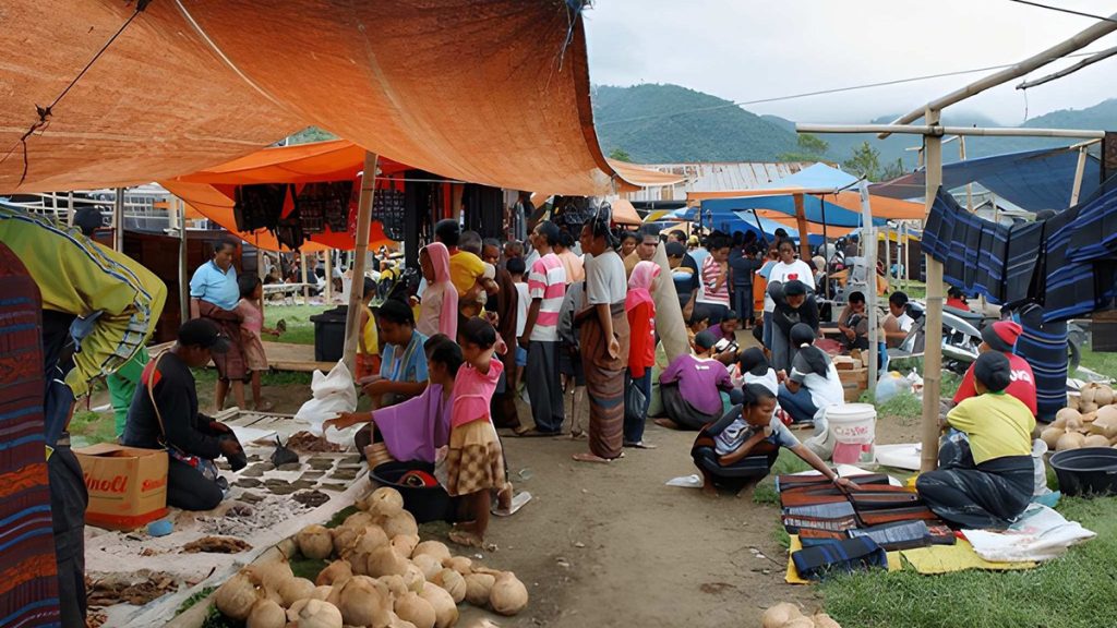 local people trading fresh produce at a traditional market in Moni Village Flores Indonesia